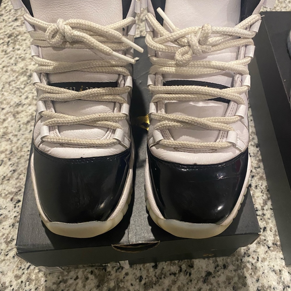 Jordan 11s Black and White Sneakers with Patent Leather